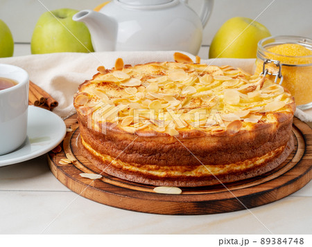 Cheesecake, apple pie, curd dessert with polenta, apples, almond flakes and cinnamon 89384748