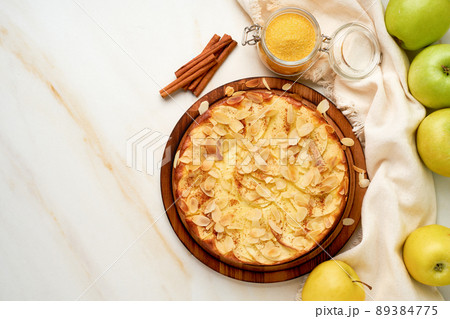 Cheesecake, apple pie, curd dessert with polenta, apples, almond flakes 89384775
