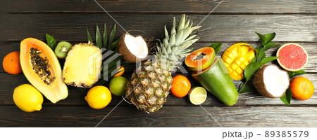 Fresh and ripe exotic fruits on wooden background 89385579