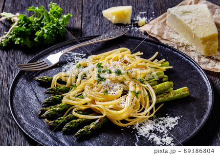roasted asparagus with pasta, cheese on plate roasted asparagus with pasta, cheese on plate 89386804