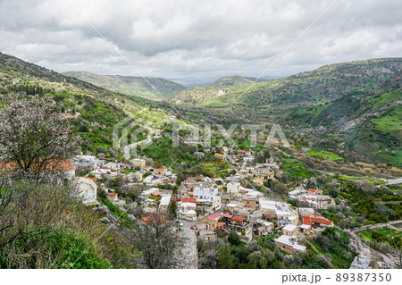 Beautiful view from Episcopi rocky cliff to the valley and the village on hillside 89387350
