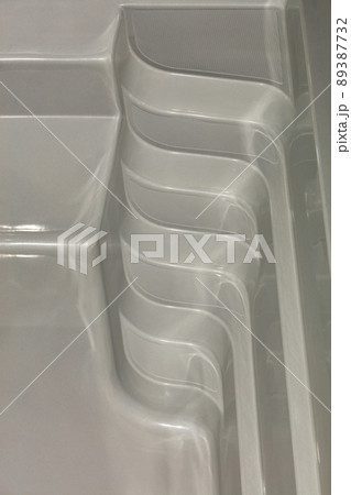 Plastic exit steps from the pool bowl. Closeup. 89387732