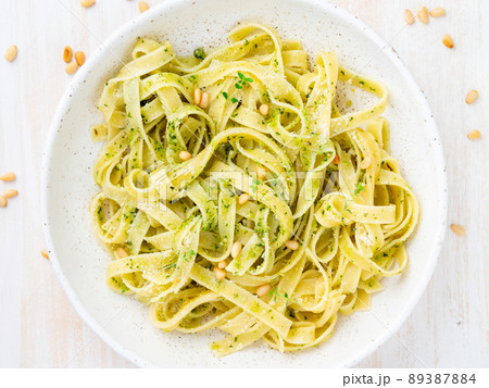Tagliatelle pasta with pesto sauce made of Basil, garlic, pine nuts, olive oil 89387884