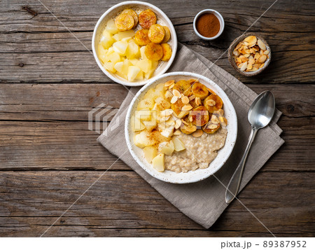Large bowl of tasty and healthy oatmeal with apple for Breakfast, morning meal. Large bowl of tasty and healthy oatmeal with apple for Breakfast, morning meal. 89387952