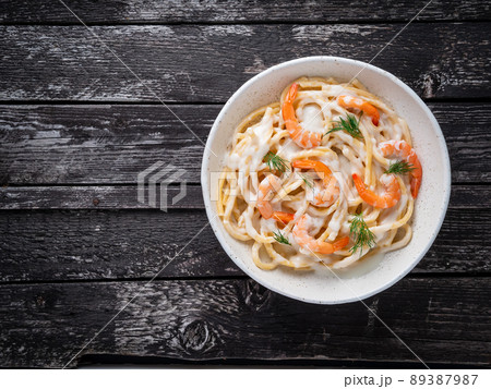 italian pasta spaghetti with shrimps, bechamel sauce and chopped dill italian pasta spaghetti with shrimps, bechamel sauce and chopped dill 89387987