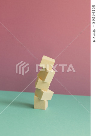 Stack of makeup sponge on mint green table. pink wall background 89394159
