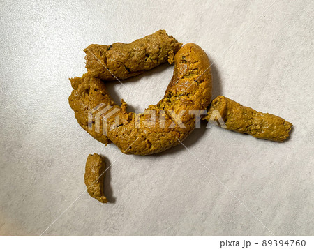 Group of dog poop on the floor 89394760