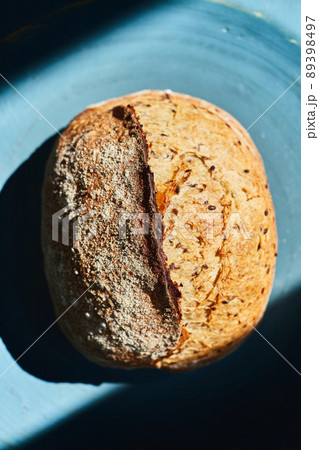 Homemade wheat bread with flax seeds. The concept of homemade bread and healthy food. Top view. Flat lay. 89398497