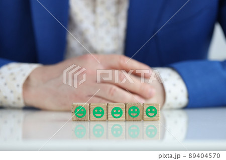 Customer and five smiling green positive emoticons Customer and five smiling green positive emoticons 89404570
