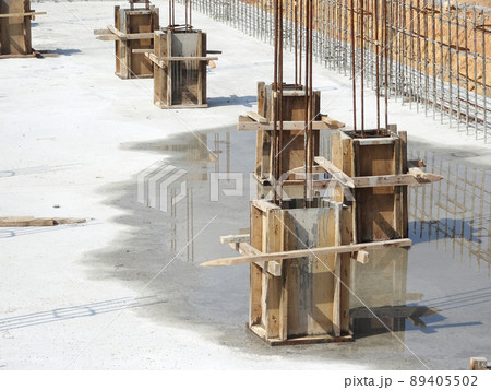 SELANGOR, MALAYSIA -JULY 7, 2021: Column stump formwork that has been installed at the construction site. Steel reinforcement bars are ready to be installed and ready to be poured concrete into it. 89405502