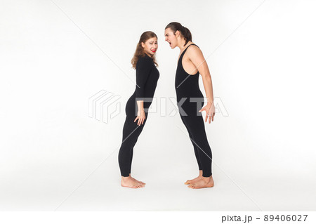 Quarrel in partnership. Angry man shout at young adult woman. Studio shot 89406027