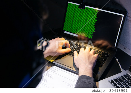Close-up image of man planning hacker attack Close-up image of man planning hacker attack 89413991
