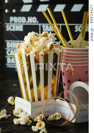 Concept of cinema accessories on wooden background 89414427