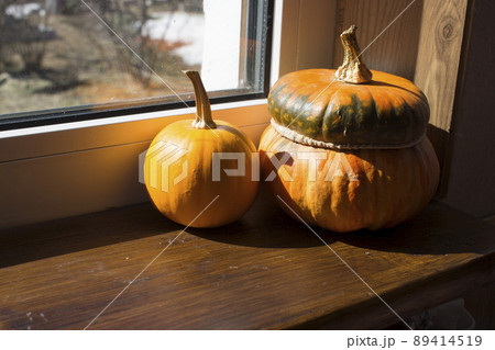 orange photo with pumpkins in front of the window 89414519