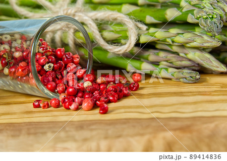 Red pepper peas with asparagus on wood board. Peas pepper. Red pepper close - up background 89414836