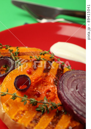Plate with baked pumpkin, close up and selective focus 89415041