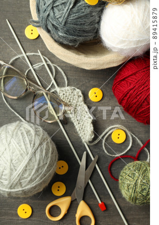 Knitting yarn concept on gray wooden background 89415879