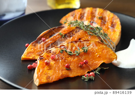 Concept of tasty food with baked pumpkin, close up Concept of tasty food with baked pumpkin, close up 89416139