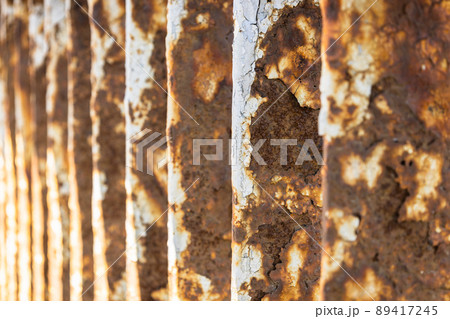 Rusty bridge railing texture background with cracked white paint 89417245