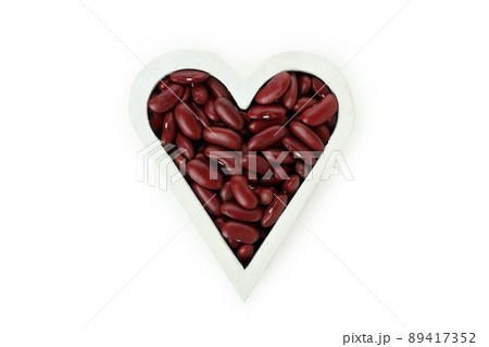 Red beans in the form of heart isolated on white background 89417352