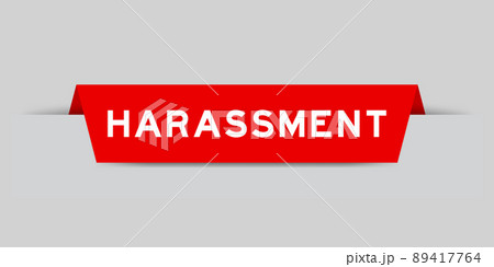 Red color inserted label with word harassment on gray background Red color inserted label with word harassment on gray background 89417764