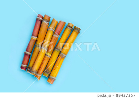 Sugar cane on blue background. Sugar cane on blue background. 89427357