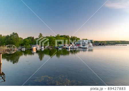 Panoramic view on Ukiel lake with marina at sunset time. Panoramic view on Ukiel lake with marina at sunset time. 89427883