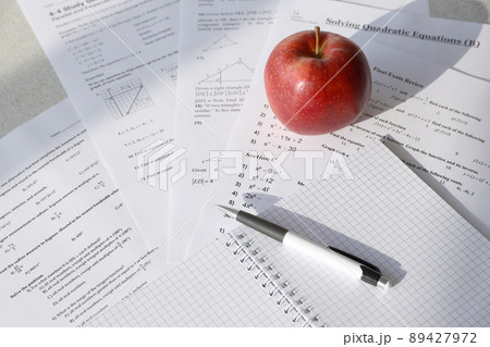 Handwriting of mathematics quadratic equation on examination, practice, quiz or test in maths class. Solving exponential equations concept. Handwriting of mathematics quadratic equation on examination, practice, quiz or test in maths class. Solving exponential equations concept. 89427972