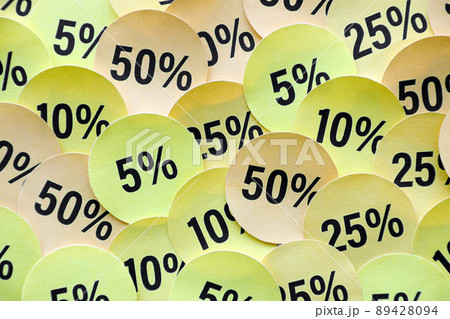 Large amount of stickers with yellow percentage values for black friday or cyber monday sale. Abstract image of discount prices 89428094