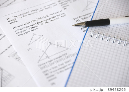 Handwriting of geometrical tasks on examination, practice, quiz or test in geometry class. Solving exponential equations concept. 89428296
