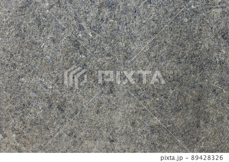 Grey shimmering background imitation dust with shiny balls. Abstract pattern sequins. Template round particles. Fresh asphalt, granite or marble Grey shimmering background imitation dust with shiny balls. Abstract pattern sequins. Template round particles. Fresh asphalt, granite or marble 89428326