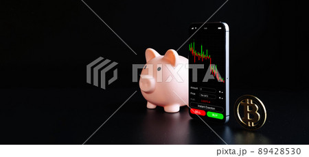 Crypto currency exchange. Pink pig bank, gold crypto currency BTC bitcoin on black background. Bitcoin trading mobile phone app. Save money investment and business finance. Crypto currency exchange. Pink pig bank, gold crypto currency BTC bitcoin on black background. Bitcoin trading mobile phone app. Save money investment and business finance. 89428530