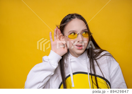 Pretty young girl brunette girl in casual white plumpness, glasses posing Pretty young girl brunette girl in casual white plumpness, glasses posing 89429847