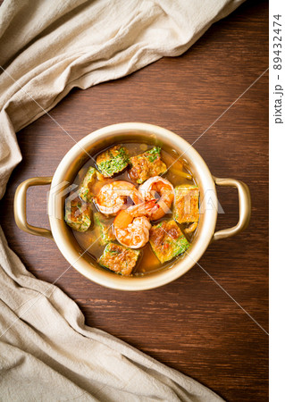 Sour soup made of Tamarind Paste with Shrimps and Vegetable Omelet 89432474