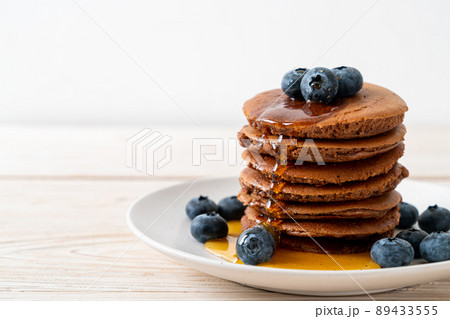 chocolate pancake stack with blueberry and honey chocolate pancake stack with blueberry and honey 89433555