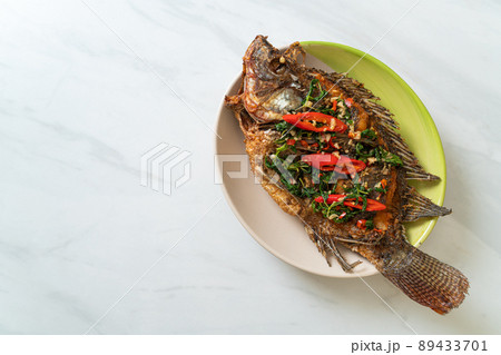 Fried Tilapia Fish with Basil chili garlic sauce 89433701