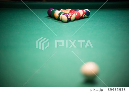Entertainment concept. Billiard table with bright colored balls 89435933