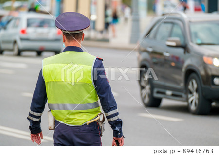 Traffic officer standing near road 89436763