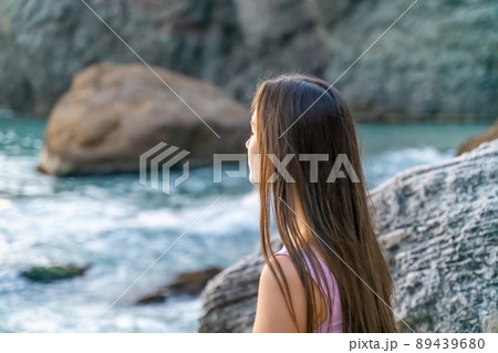 Young woman practicing yoga outdoors. Harmony and meditation concept. Healthy lifestyle 89439680