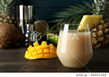 Pina colada cocktail and ingredients on wooden table 89442266