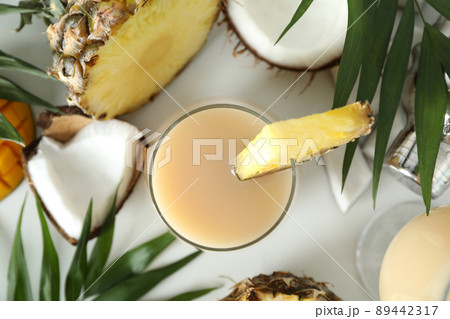 Pina colada cocktail and ingredients on white background Pina colada cocktail and ingredients on white background 89442317
