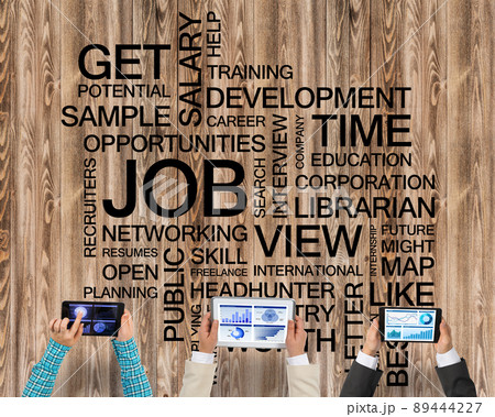 Top view of businesspeople sitting at table and using gadgets Top view of businesspeople sitting at table and using gadgets 89444227
