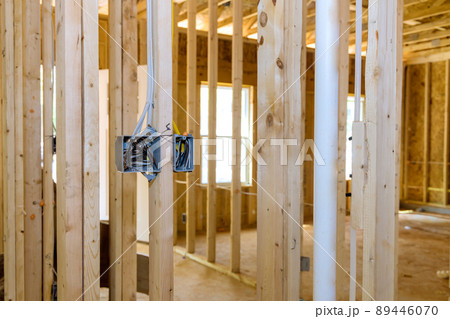Installing electric sockets on the wall new home new home construction Installing electric sockets on the wall new home new home construction 89446070
