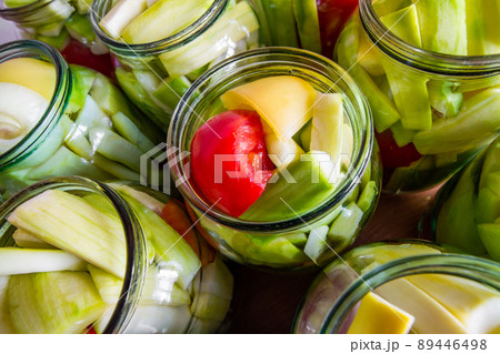 Process of home preserving of zucchini in jars. Canning vegetables for the winter. Closeup, selective focus Process of home preserving of zucchini in jars. Canning vegetables for the winter. Closeup, selective focus 89446498