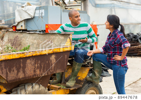 workers talking and discussing near forklift workers talking and discussing near forklift 89447678