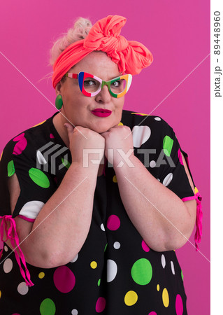 Happy Plus Size Woman Wearing Eyeglasses Smiling To Camera Standing Over Pink Background. Cheerful Millennial Female In Eyewear Posing In Studio. 89448960