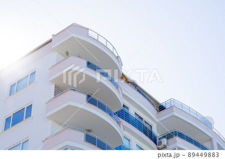 Part of a modern apartment building with large and spacious balconies. 89449883