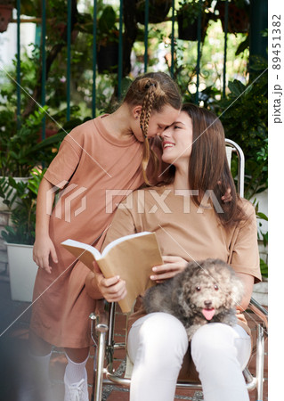 Family Resting in Backyard 89451382