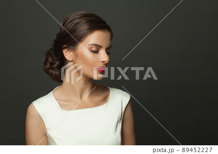 Vogue style closeup portrait of beautiful woman with red lips on black background Vogue style closeup portrait of beautiful woman with red lips on black background 89452227