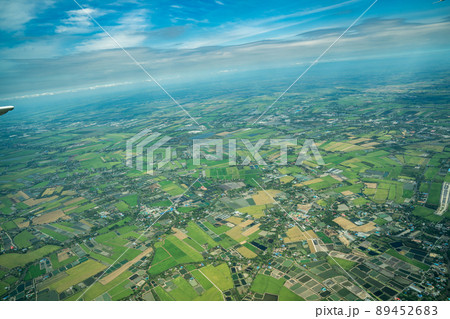 the view of green field and farm and city downtown in middle of Thailand. It shot from Jetplane. 89452683